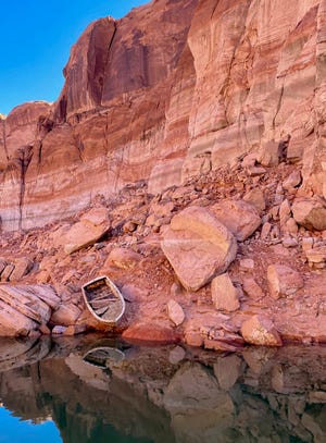 Abandoned boat on shore of Lake Powell