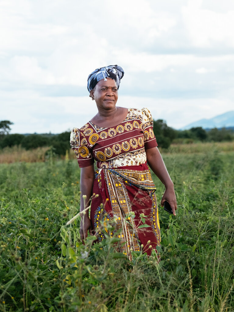 African woman standing in a field