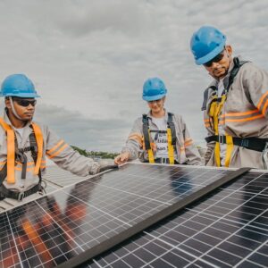 Workers installing solar panels
