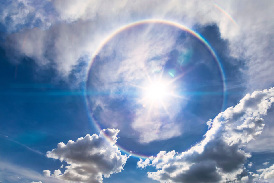 Sun shining through halo of cloud cover