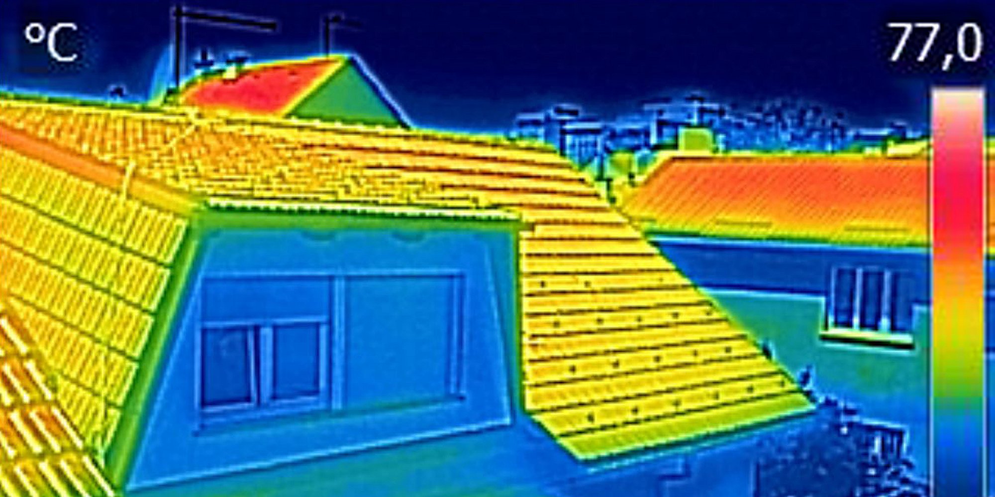 Infrared thermal image showing, warmed roofs on family homes