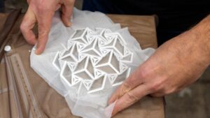 HelioSkin is a lightweight, stretchable architectural fabric that is aesthetically attractive and can wrap around complex shapes.