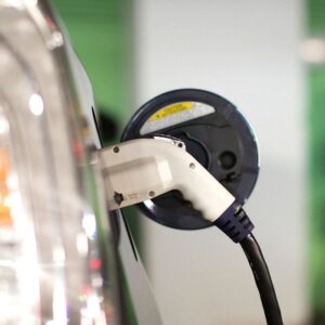 EV charging cable plugged into a vehicle