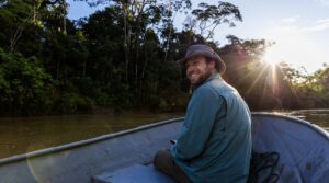 Ethan Duvall in a boat on the Amazon (credit: Naia Andrade)