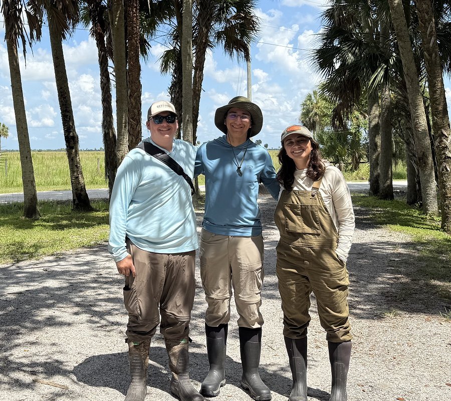 Michael Belfer ’28, Allasandra Avril Valdez, a Ph.D., Eli Barrett-Learn ’28 on ranch in Florida with Prof. Jed Sparks