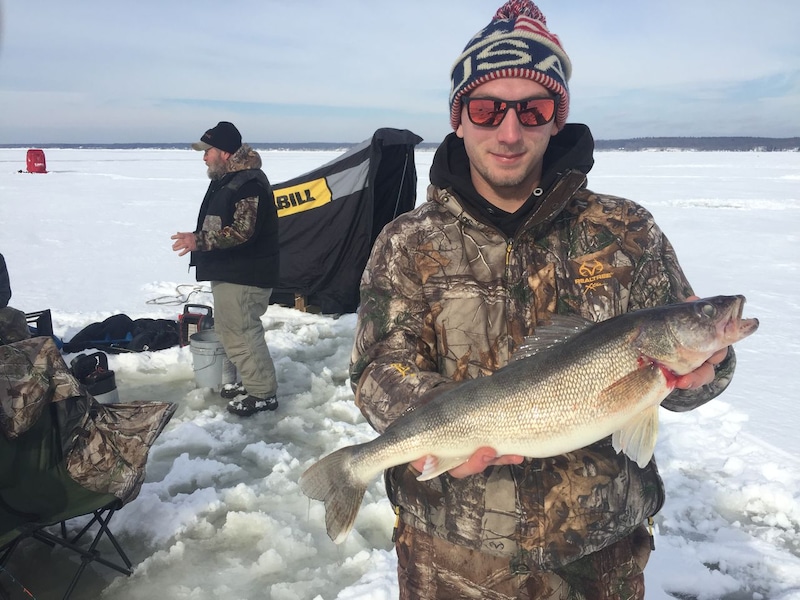 Joseph Judge, of Spencer, New York, holds up an estimated 23-inch walleye he caught through the ice on Oneida Lake off of Sylvan Beach in 2020. Oneida Lake has been ranked the second-best ice fishing destination of 2026 in America by FishingBooker.