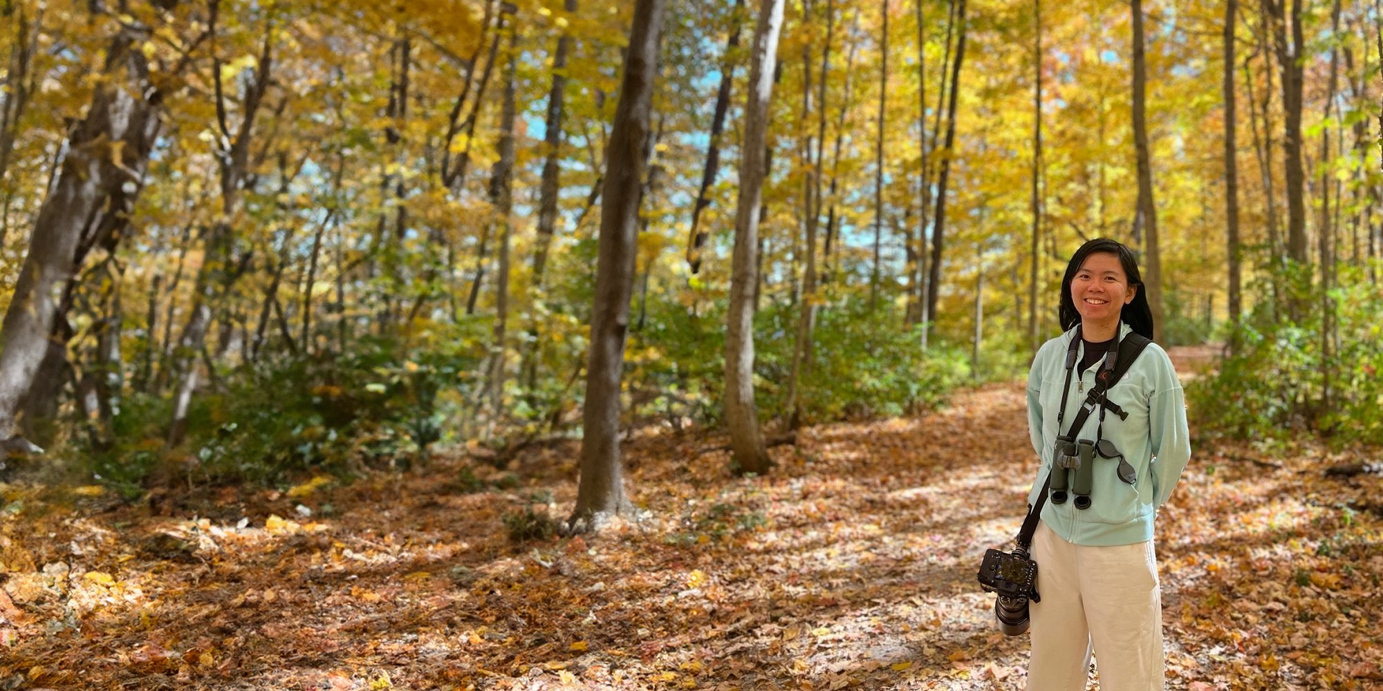 Cornell Atkinson Postdoc Fengyi Guo in the woods
