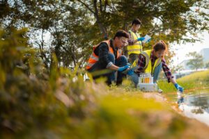 Researchers sampling water from stream