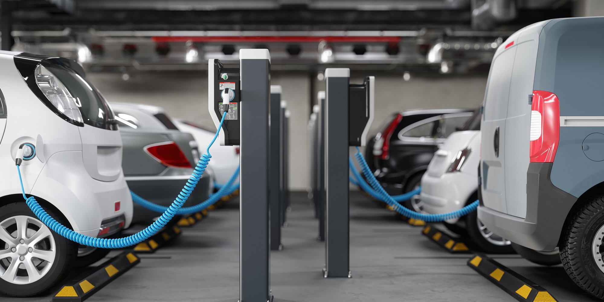 Electric cars charging in a parking garage