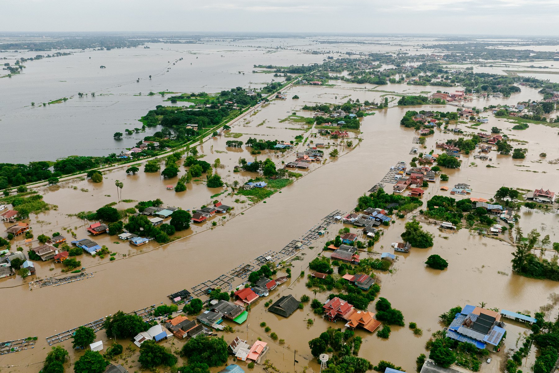 Water covers residential areas and roads due to heavy rainfall from a major storm in Thailand. (iStock)