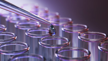 Pipette dropping liquid into test tubes